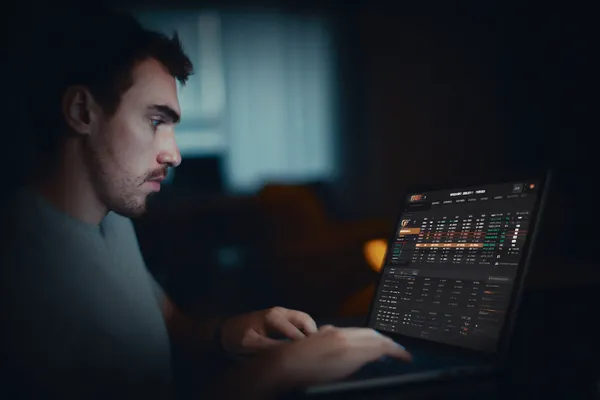 GOOD111 App — Fast, responsive, and optimized for all devices A cheerful woman in traditional clothing using her smartphone during a festive moment, showing how easily the GOOD111 app fits into everyday life.