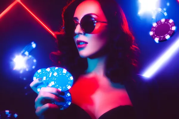 A player using their smartphone during a festive local event, representing GOOD111’s fully mobile-friendly casino.